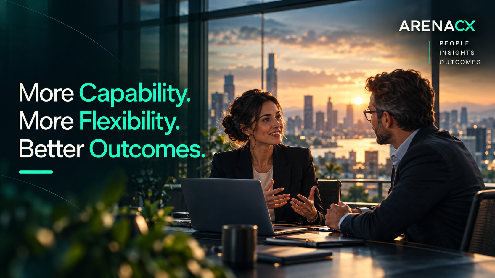 Two business professionals in conversation in a premium office with a city skyline at sunset - More Capability. More Flexibility. Better Outcomes.